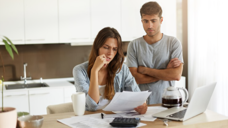 a man and a women discussing how to settle debt after divorce