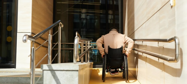  a person on wheelchair going for premises liability settlements 